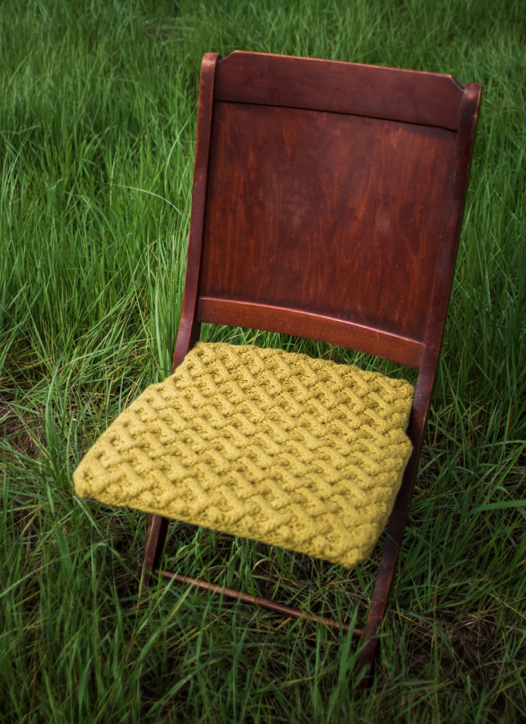 Organic cable knit basket stitch chair.