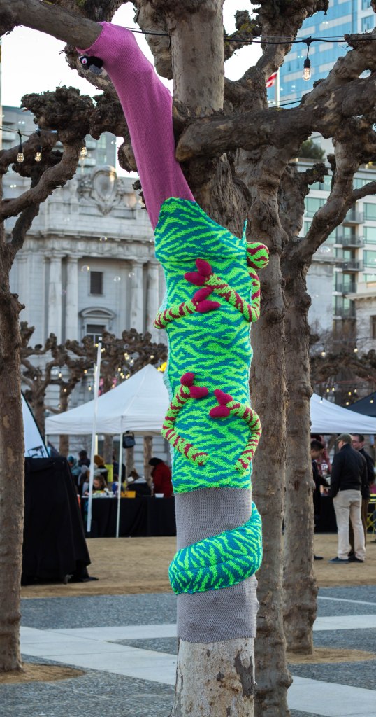 Chameleon Tree Yarn Bomb by Knits for Life for Knitting the Commons in San Francisco Civic Center